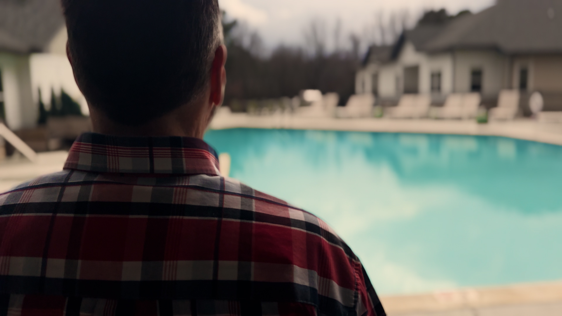 Resident at Sage North Apartment community in White House, TN looks out at the salt-water pool.