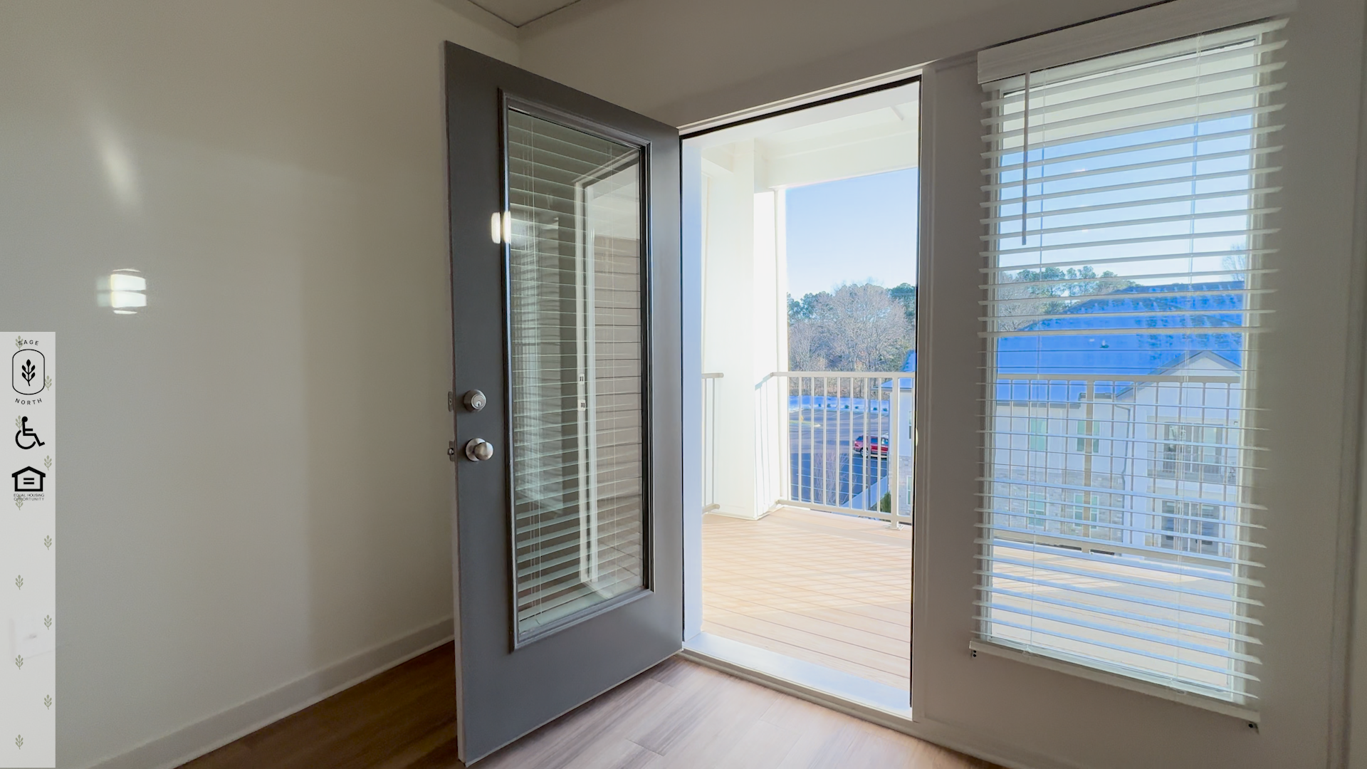 Interior of Lane Floor Plan, looking out through an open door to the home's balcony. Interior of Lane Floor Plan, looking out through an open door to the home's balcony.