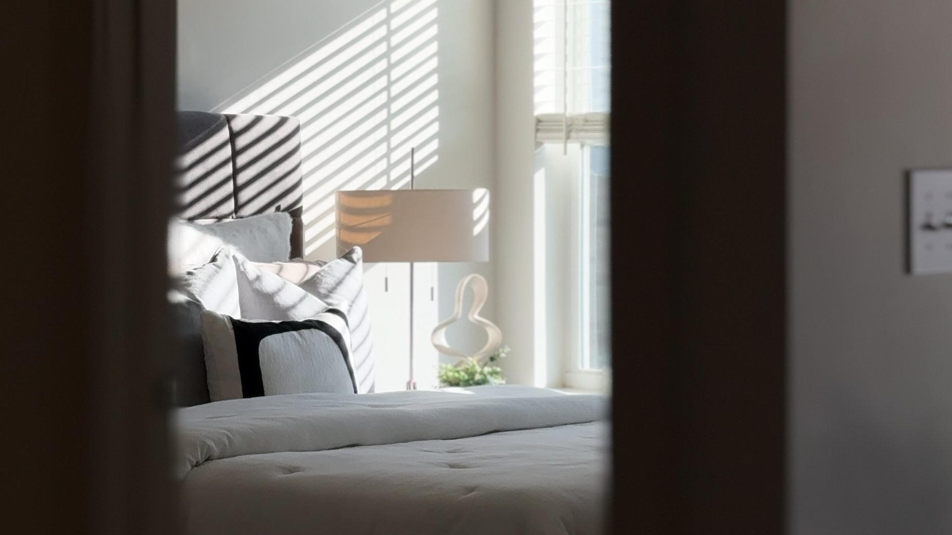 Natural light pours into the bedroom of a one bedroom apartment home at Sage North in White House, Tennessee