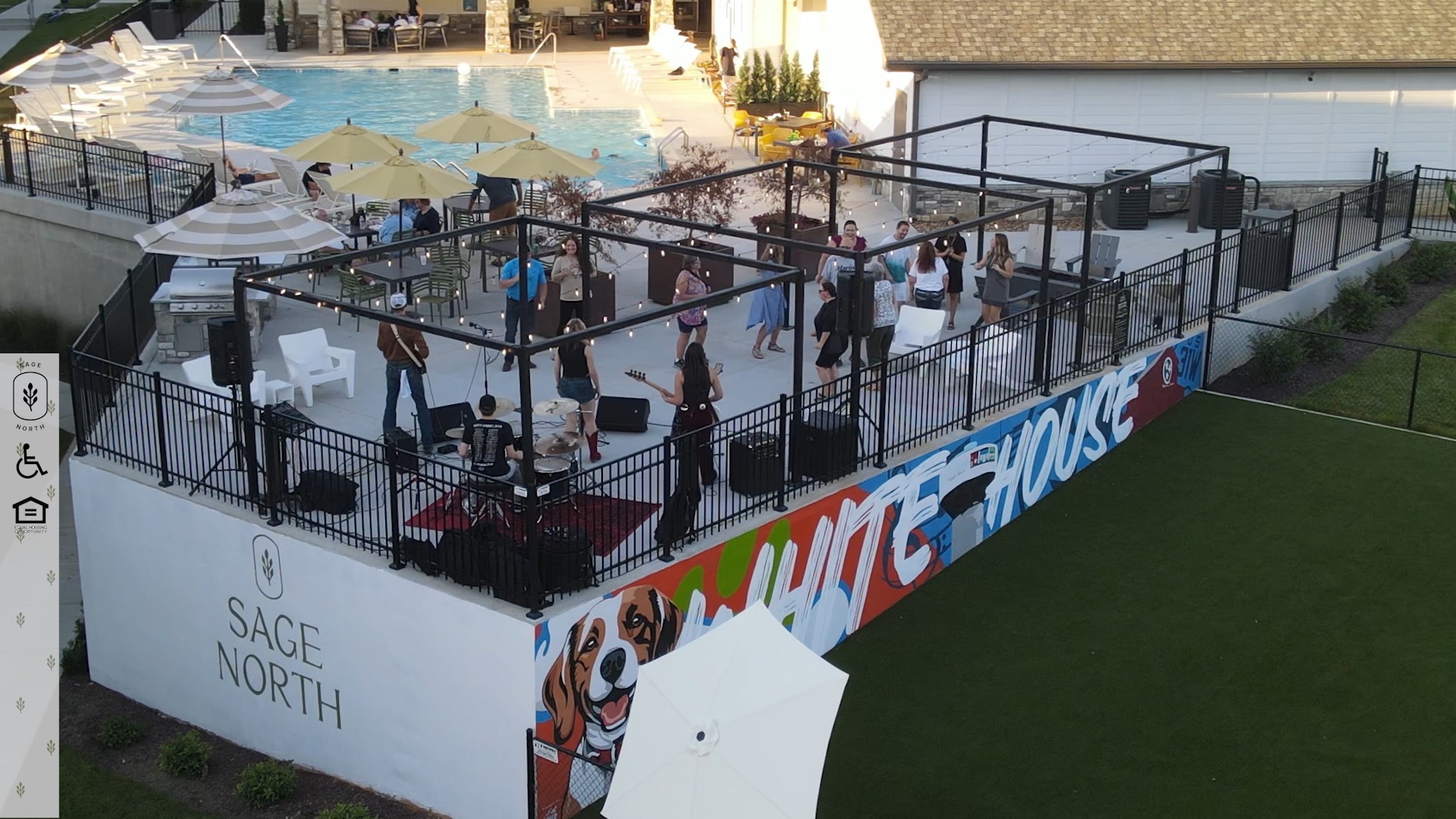 Drone shot of concert happening on sun deck at the pool at Sage North apartments in White House, TN