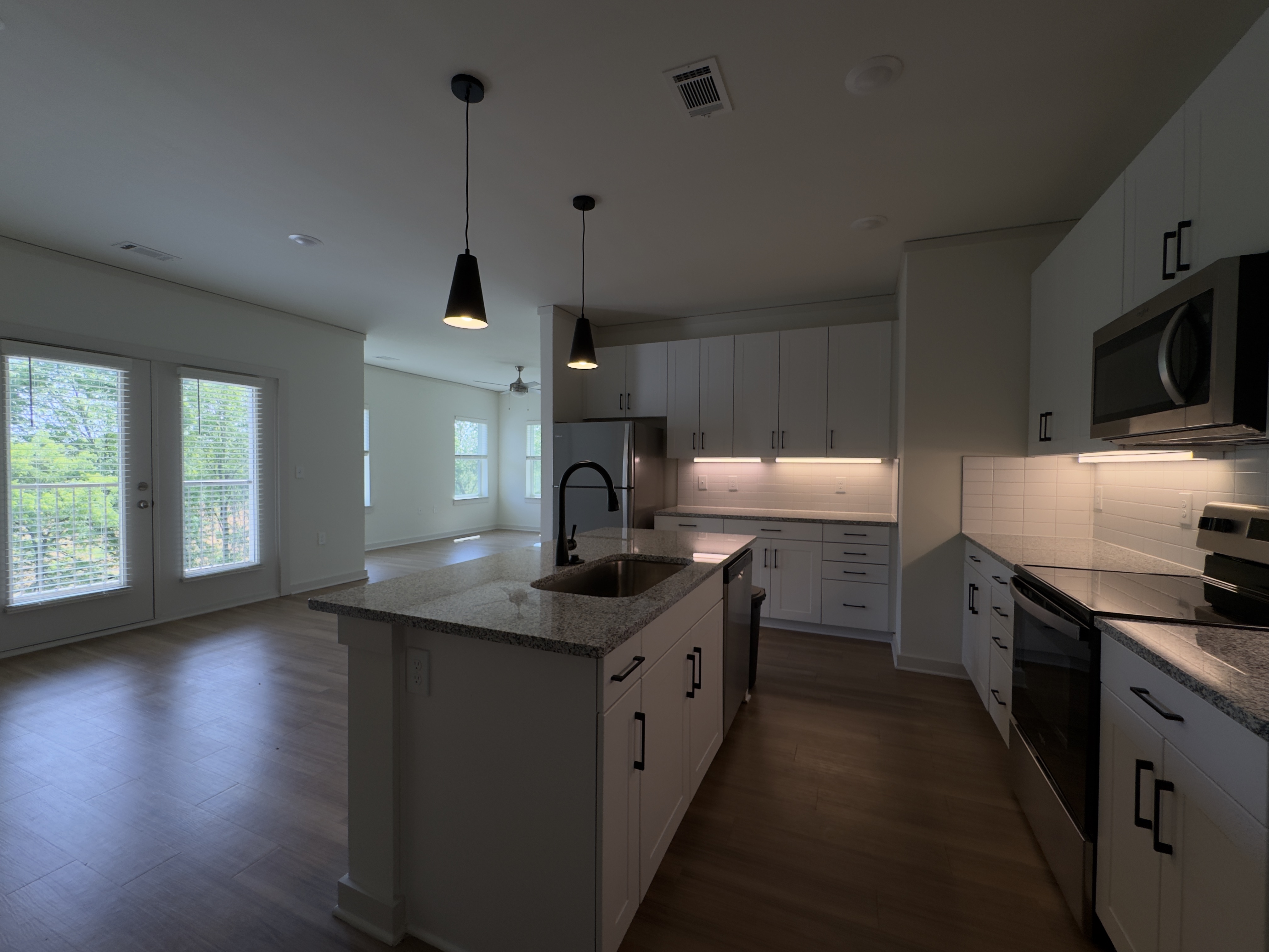 Kitchen and Living Area of Avenue 2B/2B Apartment Floor Plan at Sage North in White House, TN