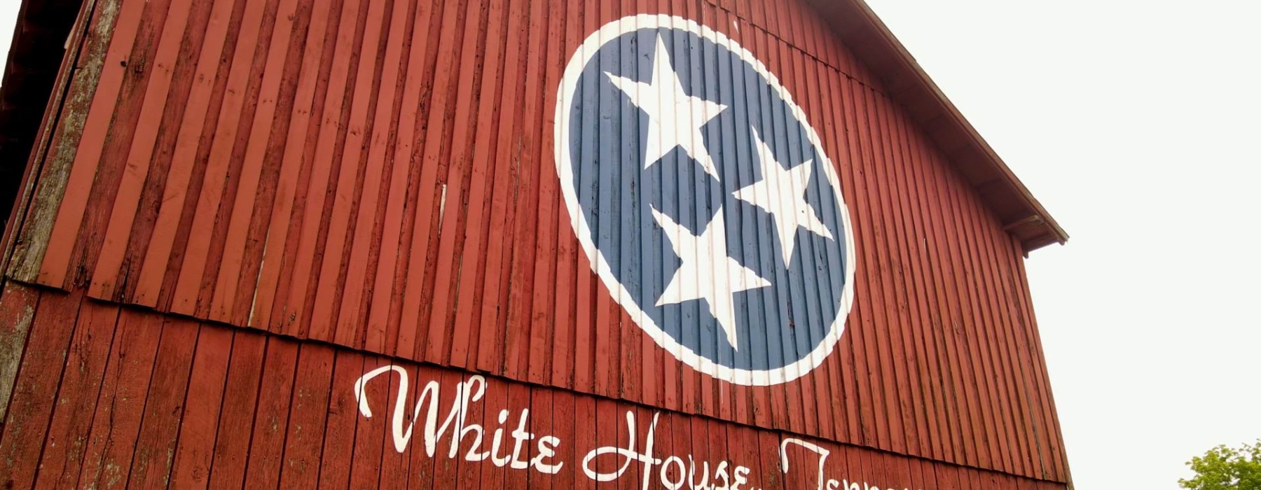 Red Barn with Tennessee Ti-Star Logo and inscription of White House, Tennessee
