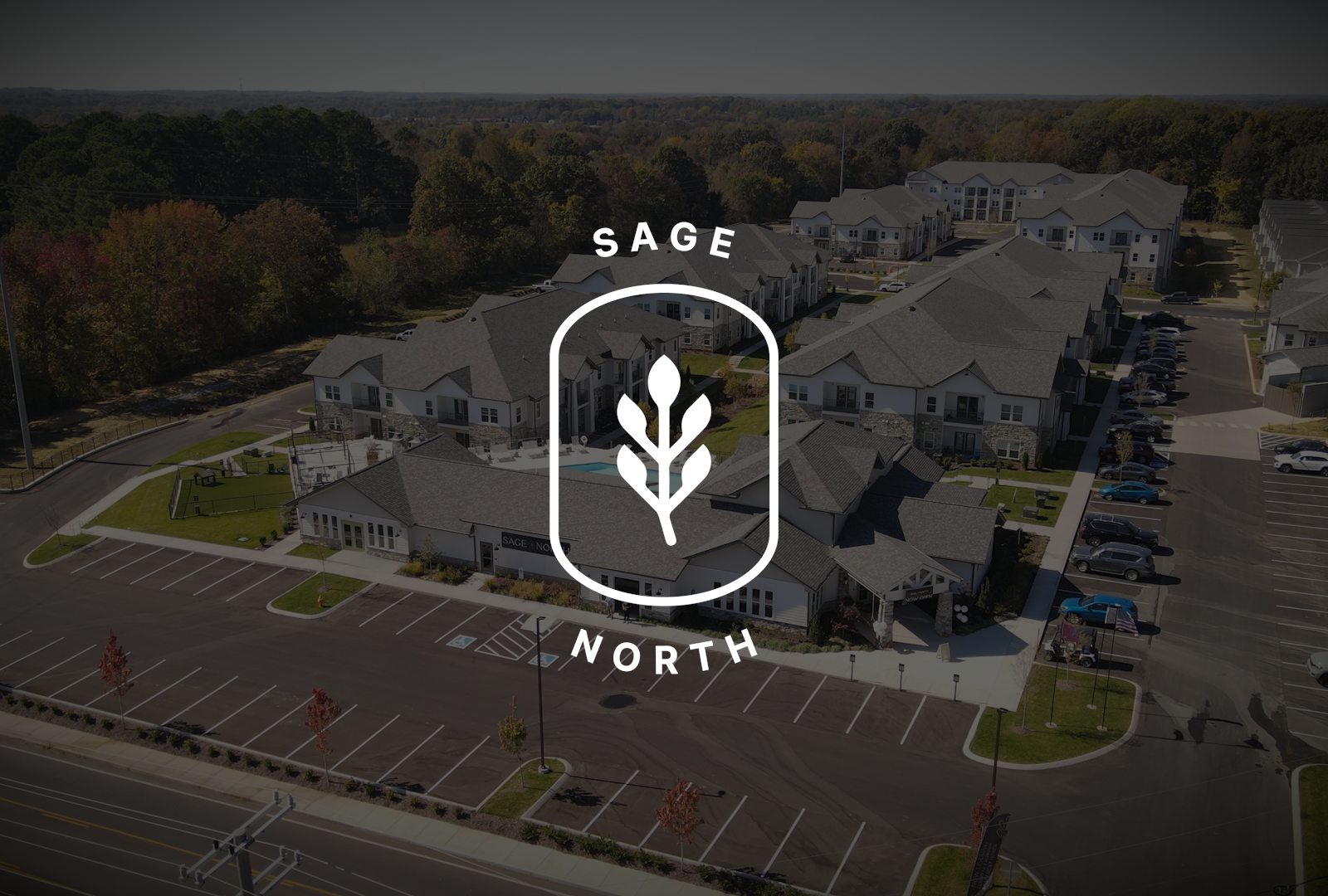 Sage North seal over drone shot of the Sage North apartment community in White House, TN