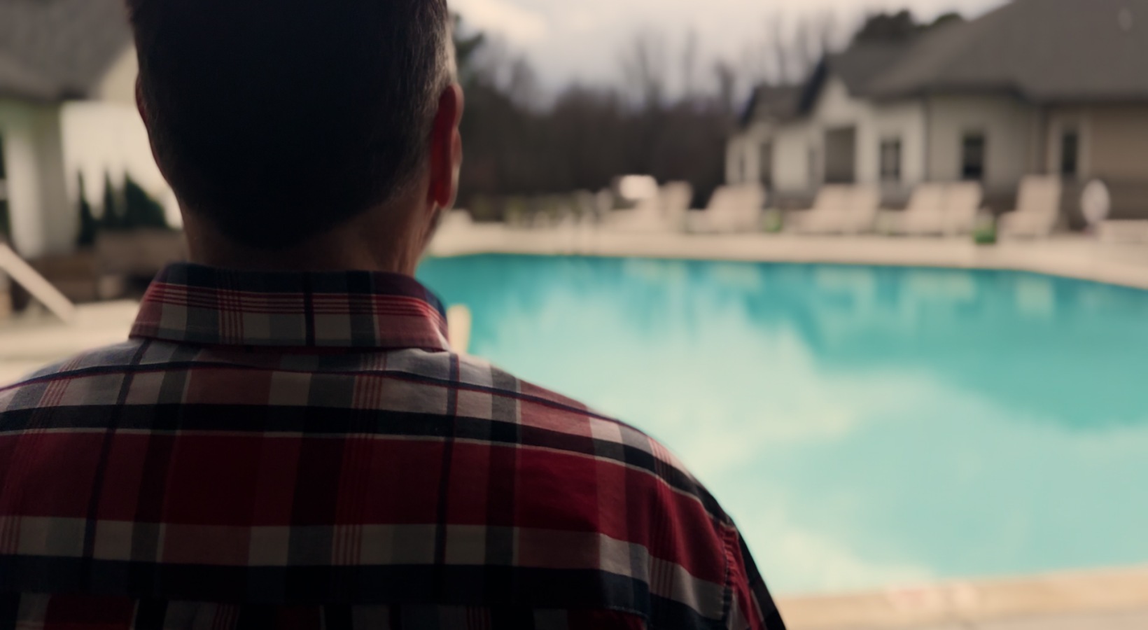 Resident at Sage North Apartment community in White House, TN looks out at the salt-water pool.