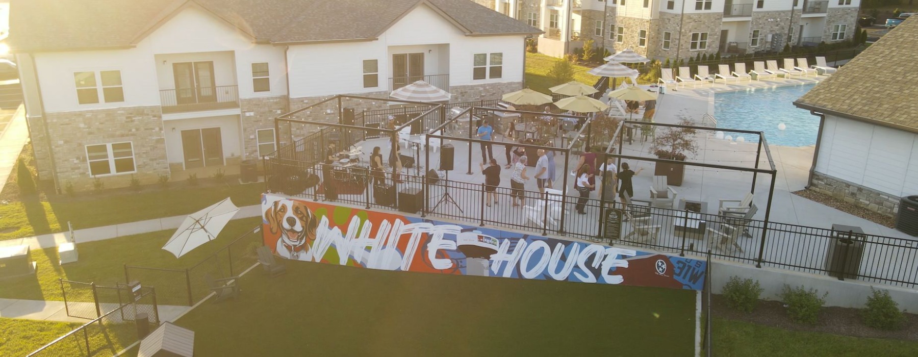 A group of residents enjoy music by a live band on the Sage North pool deck as the sun sets over the community. A group of residents enjoy music by a live band on the Sage North pool deck as the sun sets over the community.