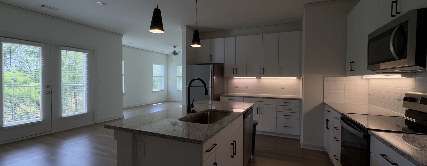 Kitchen and Living Area of Avenue 2B/2B Apartment Floor Plan at Sage North in White House, TN