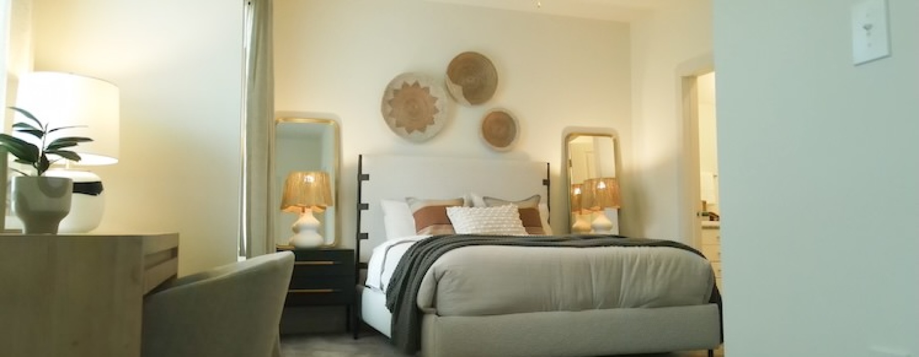 Spacious, carpeted bedroom with window at Sage North apartments in White House, TN.